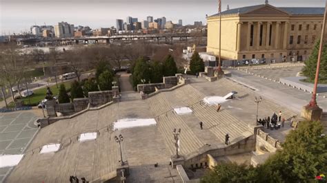 WATCH: Snowboarder Rides Iconic “ROCKY” Stairs In Philadelphia