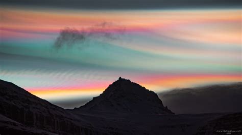 Ultra-rare 'rainbow clouds' light up the Arctic Circle like auroras in stunning new photos ...