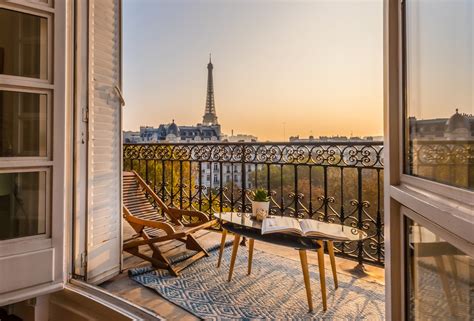Voila | beautiful paris balcony at sunset with eiffel tower view