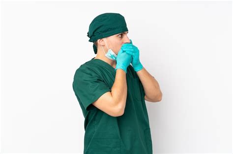 Premium Photo | Surgeon man in green uniform over isolated