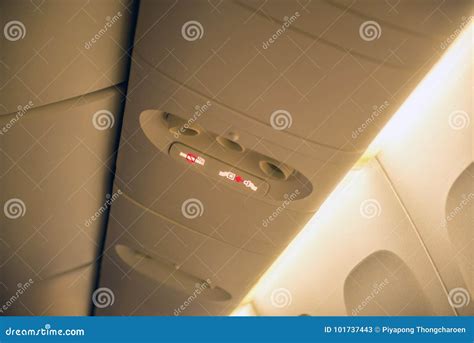 Fasten Seat Belt Sign on a Plane and No Smoking Sign on Airplane Stock Image - Image of ...