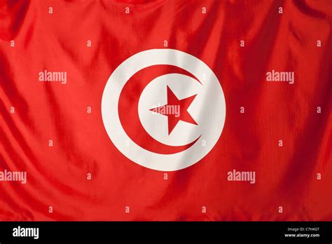 Tunisia flag, red crescent moon and red star shape in a white circle ...