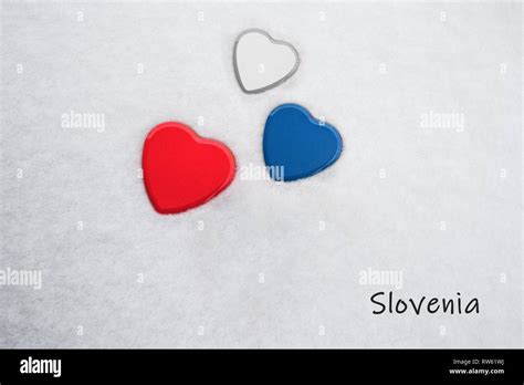 Colors of the slovenian flag (Red (Pigment), Medium Persian Blue, White) painted on three hearts ...