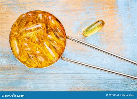 Fish Oil Supplement Capsules Stock Image - Image of grained, close: 63757163