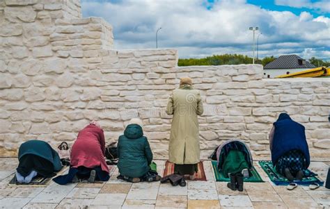 Muslim Women Pray. Namaz. Women Praying at the Stone Wall Stock Photo ...