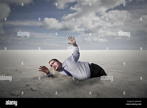 Man sinking in quicksand hi-res stock photography and images - Alamy