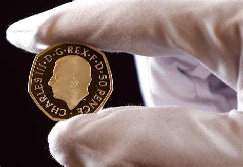 New UK coins featuring image of King Charles revealed | Reuters