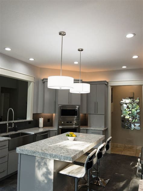 Recessed lighting modern hanging lights give this previously dark kitchen a sunny outlook ...