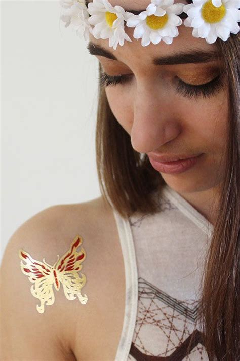 Gold Butterfly tattoo large | Butterfly tattoo, Gold butterfly, Tattoos