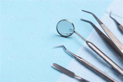 Set of dental instruments on a blue background 7883604 Stock Photo at ...