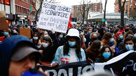 Paris protests: Police clash with protesters as violence flares at anti ...