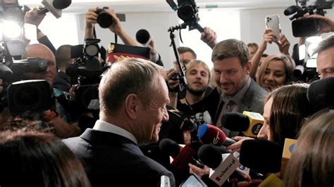 Poland's popcorn moment as pro-EU leader Tusk returns to power - BBC News