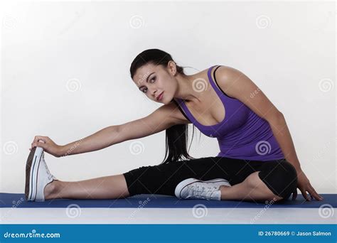 Stretching Exercises on a Mat Stock Image - Image of active, exercises: 26780669