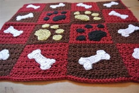 Paw prints and bones sewed onto a sweet little blanket. Perfect for a car seat or to spoil your ...