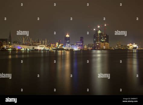 Germany, Hamburg, View from Schanzenweg to Elbphilharmonie at night, right museum ship Cap San ...