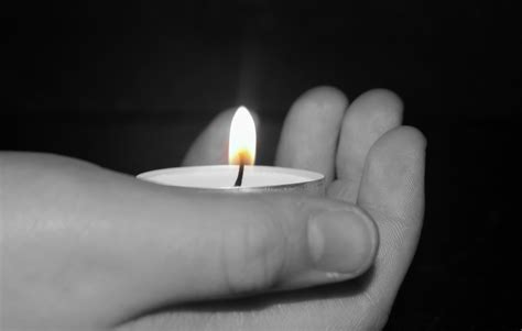 2560x1440 wallpaper | selective photo of human hand holding tealight candle | Peakpx