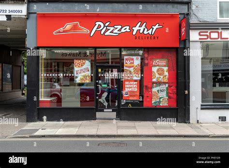 Pizza Hut delivery shop Stock Photo - Alamy