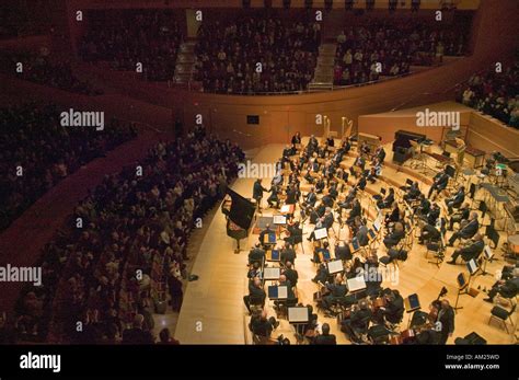 The Los Angeles Philharmonic orchestra performing at the new Disney Concert Hall designed by ...