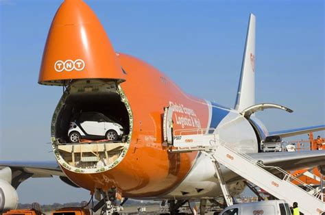 TNT Boeing 747 Cargo Plane with a Smart Car loaded by the nose Helicopter Plane, Aviation Humor ...
