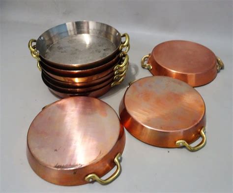 Nine red copper pans - Catawiki