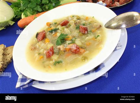 Cabbage soup with Mettwurst sausage and greens Stock Photo - Alamy