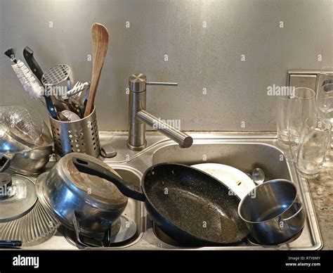 Heap of dirty utensils in the sink, close up of dirty kitchen Stock ...