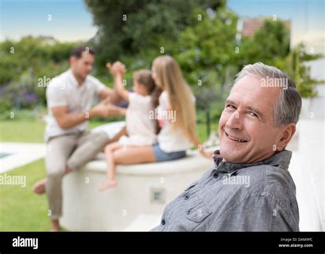 Older man smiling outdoors Stock Photo - Alamy