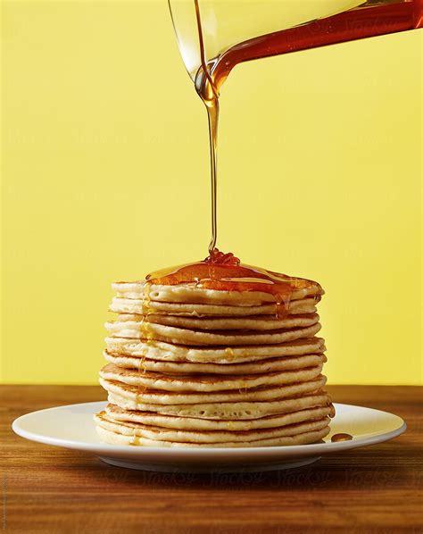 "Pouring Maple Syrup On A Stack Of Pancakes" by Stocksy Contributor ...