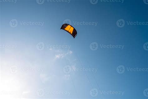 Kitesurfing parachute flies in the sky 7641301 Stock Photo at Vecteezy