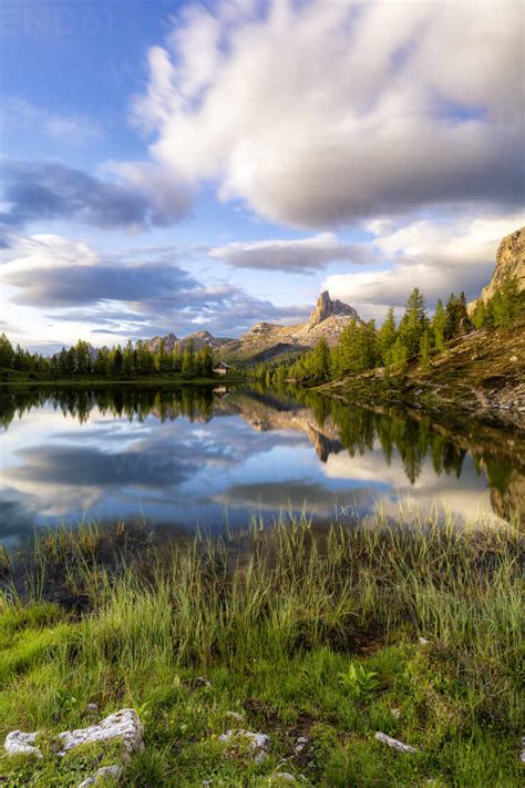 Sunrise over Becco di Mezzodi and pristine alpine Lake Federa in summer, Ampezzo Dolomites ...