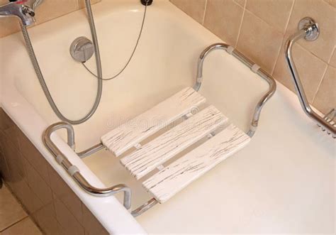 Bench seat on handicap tub stock photo. Image of white - 193923984