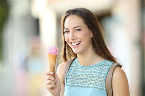 Woman Holding an Ice Cream and Looking at You Stock Photo - Image of ...