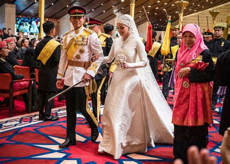 Prince Mateen of Brunei's new wife Anisha copies Kate Middleton in dazzling caped wedding guest ...