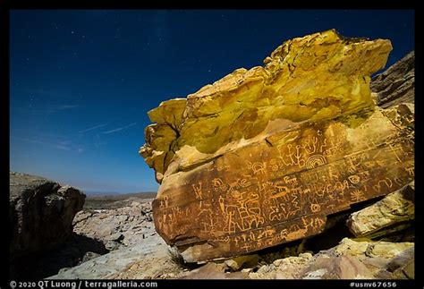 Picture/Photo: Newspaper Rock with petroglyphs at night with moonlight. Gold Butte National ...