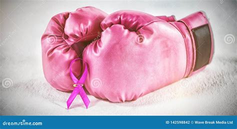 Close-up of Pink Breast Cancer Awareness Ribbon with Boxing Gloves ...