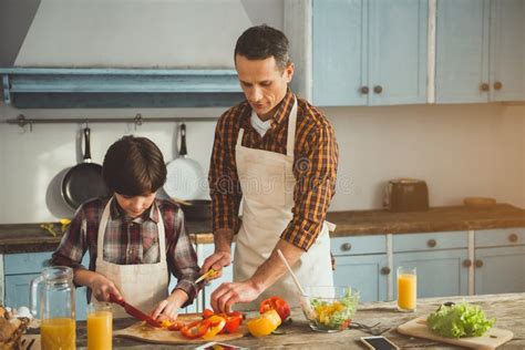 Little Boy Assisting His Dad in Cooking Stock Image - Image of home, cook: 115970711