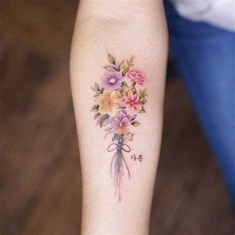 11 the most gentle flower tattoos for girls by Silo | iNKPPL | Watercolor tattoo flower, Bouquet ...