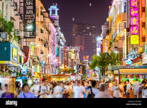 Pedestrians walk on Zhongshan Road at night in Xiamen, China Stock Photo - Alamy