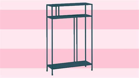 a black shelf against a pink and white striped wall with two shelves on each side