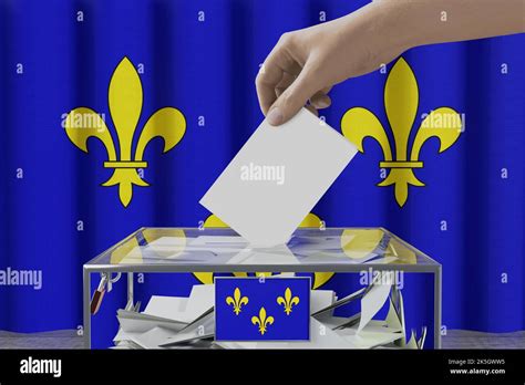 Ile de France flag, hand dropping ballot card into a box - voting/ election concept - 3D ...