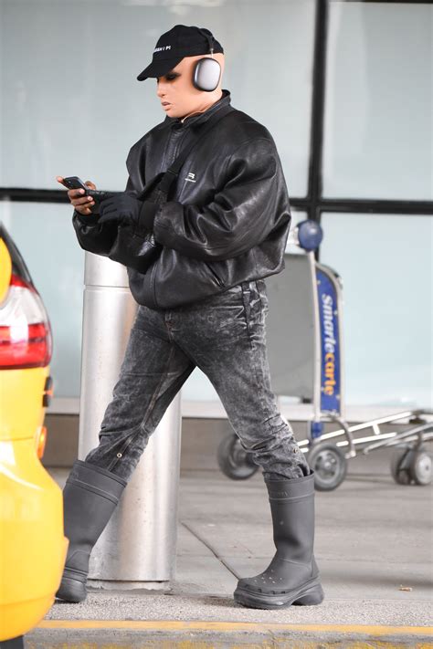 Kanye West spotted wearing creepy white prosthetic mask after changing ...