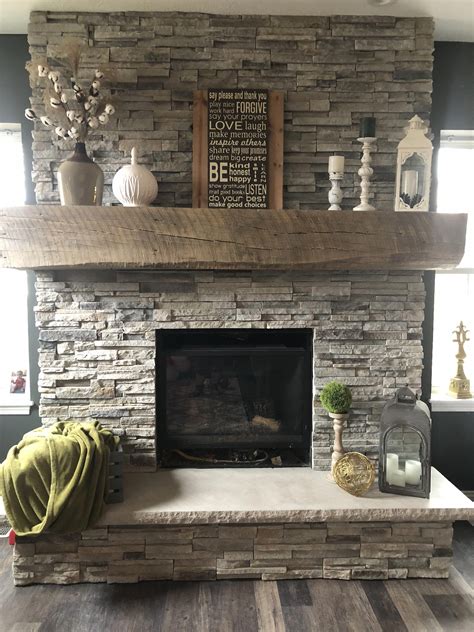 Stone fireplace with barn mantle #basementdecoratingonabudget ...