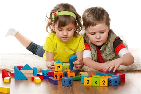 Two Children are Playing on the Floor Stock Image - Image of girl, floor: 24072153