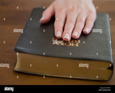 Hand On Bible High Resolution Stock Photography and Images - Alamy