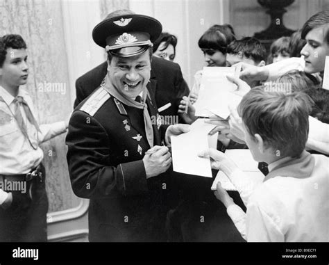 Cosmonaut Anatoly Filipchenko giving autographs to a group of Young Pioneers from Budapest ...