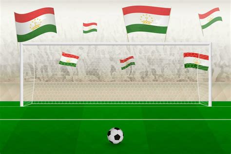 Tajikistan football team fans with flags of Tajikistan cheering on stadium, penalty kick concept ...