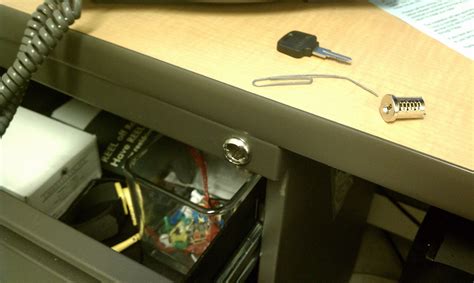 Dismantling a desk drawer lock with a paper clip. - Undrblog