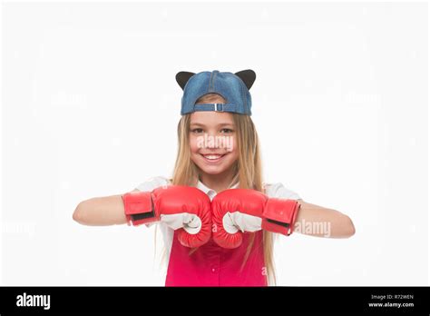 Happy child in boxing gloves isolated on white. Little girl smile before training or workout ...