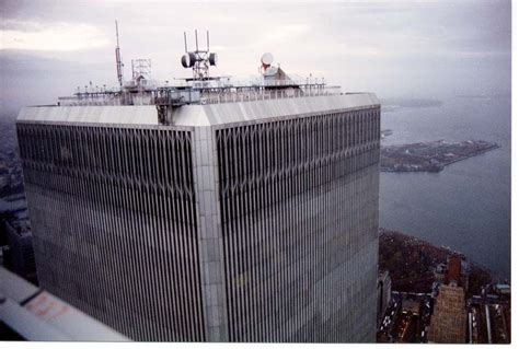 an aerial view of the top of a tall building with antennas on it's roof