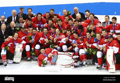 Canada players pose with their gold medals after winning the Men's Ice ...